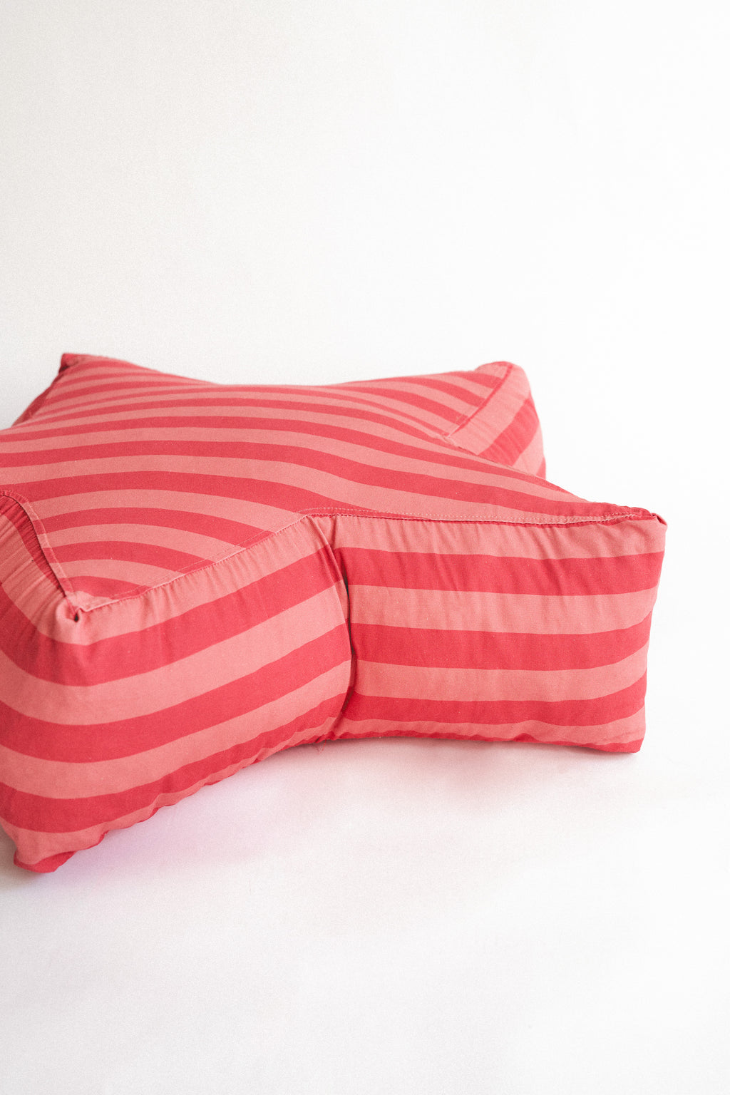 Red and pink striped pillow on a white background red and pink stripped star pillow, star beanbag, pink star beanbag 